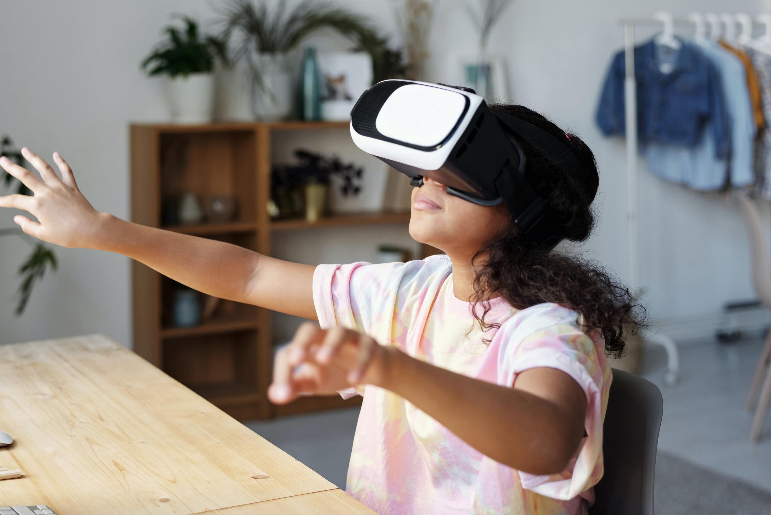 girl-in-white-and-pink-shirt-wearing-white-vr-goggles-4144041