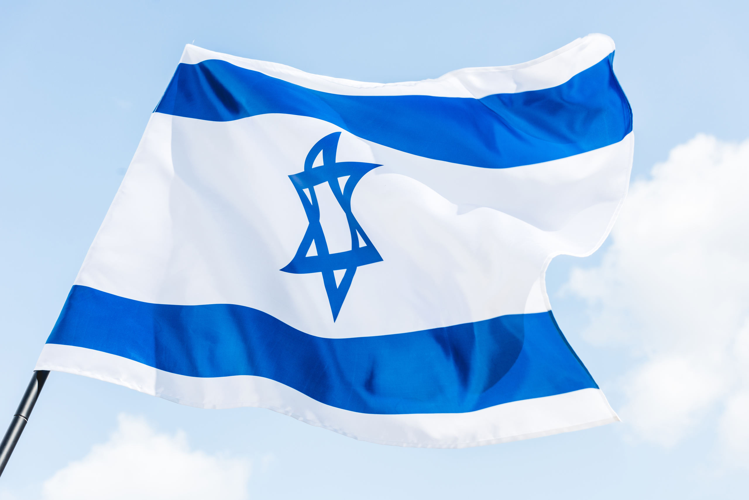 low-angle-view-of-national-israel-flag-with-star